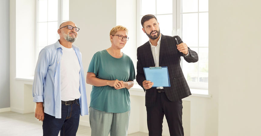 agent showing property to couple